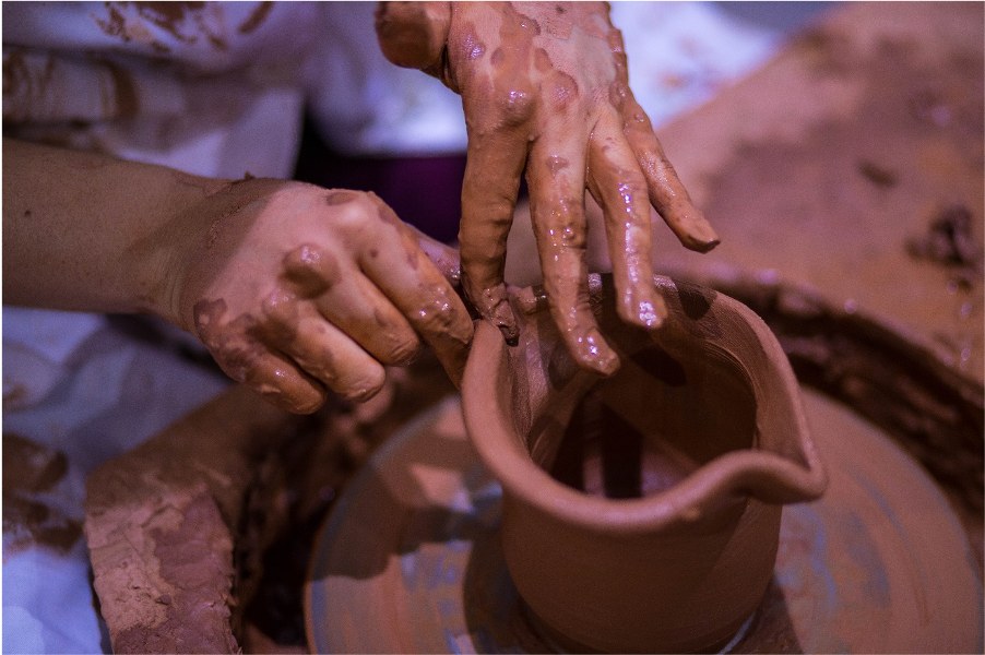 person using clay