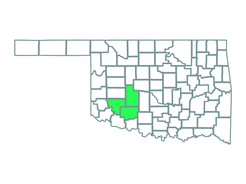 a map showing the state of oklahoma and highlighting caddo, comanche and kiowa counties where the blue canyon wind farm is located.