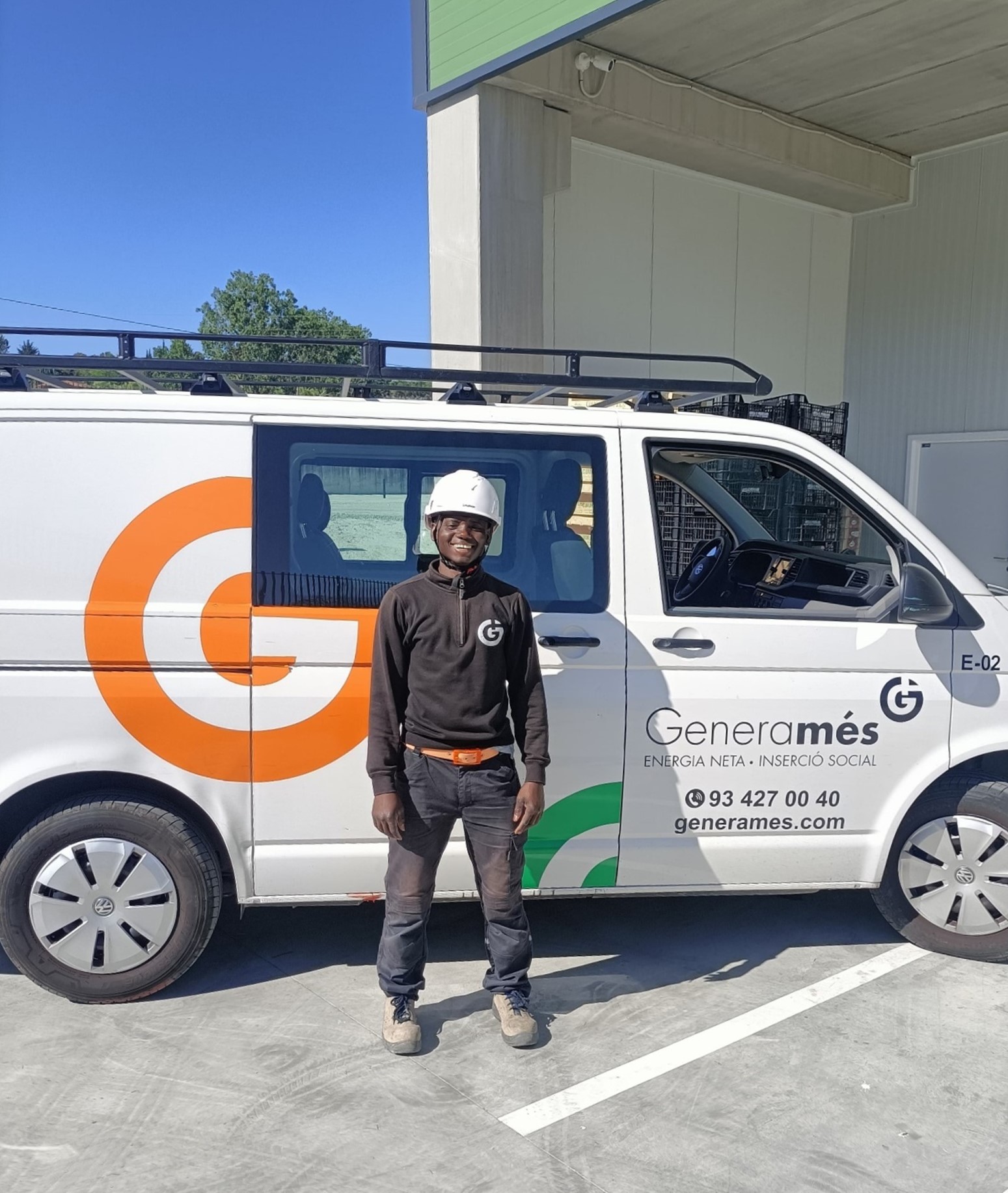 Saikoü Balde in front of a Generamés white van