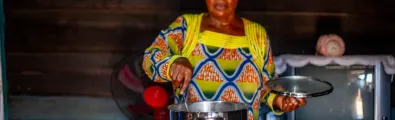 Woman stiring a pot on an smart cooktop