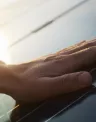 hand and solar panel